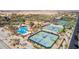 A high angle of the community's tennis courts, featuring multiple green and blue courts at 5550 N Luna Dr, Eloy, AZ 85131