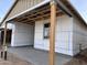 Exterior construction of a house with a covered patio and window installation progress at 5583 S 240Th Ln, Buckeye, AZ 85326