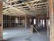 View of a room under construction showing the framing and open ceiling at 5583 S 240Th Ln, Buckeye, AZ 85326