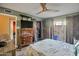 Relaxing bedroom with dresser and sliding doors leading to a private patio at 620 S Allred Dr, Tempe, AZ 85288