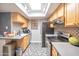 Bright kitchen with skylight, tile backsplash, and modern appliances at 620 S Allred Dr, Tempe, AZ 85288