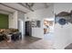 Living room view of the eat-in kitchen featuring open floor plan and natural light at 620 S Allred Dr, Tempe, AZ 85288