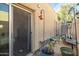 Private back patio with a sliding glass door, bird feeder, and block wall at 620 S Allred Dr, Tempe, AZ 85288