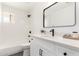 Well-lit bathroom with a shower-tub combo, modern vanity, and sleek fixtures at 6655 E Rustic Dr, Mesa, AZ 85215