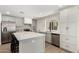 Bright kitchen features gray cabinets, a large center island, and stainless steel appliances at 6655 E Rustic Dr, Mesa, AZ 85215