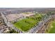 Panoramic community aerial showcasing soccer and baseball fields, and green landscapes at 6656 W Springfield Way, Florence, AZ 85132