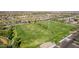 Aerial view of community soccer fields lined in the background by a lush green landscape at 6656 W Springfield Way, Florence, AZ 85132