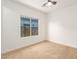 Bedroom featuring carpet and a bright window offering ample natural light at 6656 W Springfield Way, Florence, AZ 85132