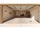 Spacious, empty two car garage featuring high ceilings and ample space at 6656 W Springfield Way, Florence, AZ 85132