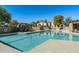 Community pool features lounge seating, covered patio, and mountain views at 6711 E Camelback Rd # 81, Scottsdale, AZ 85251