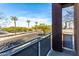 Enjoy the view from this balcony overlooking the street lined with palm trees and blue skies at 6745 N 93Rd Ave # 1166, Glendale, AZ 85305