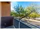 Relax and enjoy the view from the balcony overlooking the green trees and the road at 6745 N 93Rd Ave # 1166, Glendale, AZ 85305