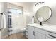 Bright bathroom featuring a shower-tub combo, white vanity, and modern finishes at 6745 N 93Rd Ave # 1166, Glendale, AZ 85305