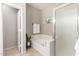 Bright bathroom with a soaking tub, glass shower, and botanical-themed decorations at 6745 N 93Rd Ave # 1166, Glendale, AZ 85305