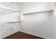 Spacious walk-in closet featuring wire shelving and hardwood flooring at 6745 N 93Rd Ave # 1166, Glendale, AZ 85305