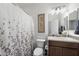 Bathroom with a shower-tub combo, vanity and neutral finishes at 678 E Cobble Stone Dr, Queen Creek, AZ 85140