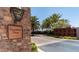 Community entrance with stone wall, decorative street sign and lush landscaping at 678 E Cobble Stone Dr, Queen Creek, AZ 85140