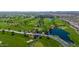 Overhead view of a sprawling golf course with a stream, bridges, and scenic water hazards, surrounded by desert landscape at 678 E Cobble Stone Dr, Queen Creek, AZ 85140