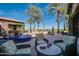 Inviting outdoor seating area with comfortable chairs and a blue tiled fountain at 678 E Cobble Stone Dr, Queen Creek, AZ 85140