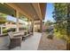 Relaxing covered patio with comfortable seating and beautiful outdoor views at 678 E Cobble Stone Dr, Queen Creek, AZ 85140