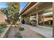 Inviting covered patio with grill and outdoor seating, perfect for relaxing and entertaining guests at 678 E Cobble Stone Dr, Queen Creek, AZ 85140