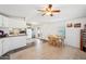 Open-concept kitchen and dining area with white cabinetry and appliances, great for entertaining at 690 S 92Nd Pl, Mesa, AZ 85208