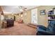 Comfortable living room features neutral walls and carpet, ceiling fan and lots of natural light at 690 S 92Nd Pl, Mesa, AZ 85208