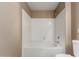 Bathroom with white tiled shower and tub at 7009 E Acoma Dr # 1046, Scottsdale, AZ 85254