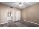 Neutral bedroom with ceiling fan, carpet, and ensuite bathroom at 7009 E Acoma Dr # 1046, Scottsdale, AZ 85254