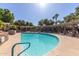 Sparkling swimming pool with pergolas, sun loungers and a pool entrance with handrails and steps at 7009 E Acoma Dr # 1046, Scottsdale, AZ 85254