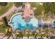 Overhead view of the resort-style community pool with palm trees, lounge chairs, and a swimming area at 815 E Laddoos Ave, San Tan Valley, AZ 85140