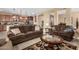 Cozy living room features neutral paint, tile floors, natural lighting and comfortable seating at 815 E Laddoos Ave, San Tan Valley, AZ 85140