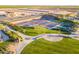 Aerial view of pickleball courts showcasing the play area, landscaping and the surrounding green spaces at 815 E Laddoos Ave, San Tan Valley, AZ 85140