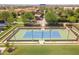 Aerial view of a tennis court in a community with well-maintained landscaping and walking paths at 815 E Laddoos Ave, San Tan Valley, AZ 85140