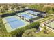 Aerial view of community tennis courts, showcasing well-maintained facilities and lush landscaping at 815 E Laddoos Ave, San Tan Valley, AZ 85140