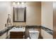 Bathroom with tiled accents, traditional sink, and vanity at 8214 E Kael St, Mesa, AZ 85207