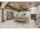 Dining room with fireplace and a view of the home's staircase at 8214 E Kael St, Mesa, AZ 85207