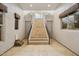 Entryway with staircase, landing, and natural light at 8214 E Kael St, Mesa, AZ 85207