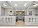 A gorgeous foyer with unique architectural details, arches, skylights, wrought iron railing, and tile flooring at 8214 E Kael St, Mesa, AZ 85207