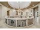 Spacious foyer features a decorative chandelier, circular balcony and neutral color palette at 8214 E Kael St, Mesa, AZ 85207