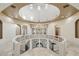 Spacious foyer features a decorative chandelier, circular balcony and neutral color palette at 8214 E Kael St, Mesa, AZ 85207