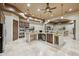 Entertainer's kitchen boasts granite countertops, dual ovens, and a bar-height counter at 8214 E Kael St, Mesa, AZ 85207