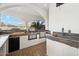 Well-equipped outdoor kitchen featuring a built-in grill, sink, and counter space for effortless meal preparation at 8214 E Kael St, Mesa, AZ 85207