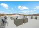 Spacious rooftop deck offering scenic views and comfortable seating, creating an ideal space for relaxation at 8214 E Kael St, Mesa, AZ 85207