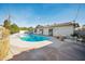 Backyard showcasing a private pool, white exterior home, a lounge chair, and ample patio space at 8432 E Keim Dr, Scottsdale, AZ 85250