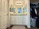 Bright bathroom featuring a vanity with white cabinets, granite counters, and dual mirrors at 8477 W Tinajas Dr, Arizona City, AZ 85123