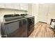 Modern laundry room with a side-by-side washer and dryer at 8477 W Tinajas Dr, Arizona City, AZ 85123