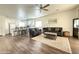 Open concept living room with hardwood floors and a light color scheme allowing for a bright living space at 8477 W Tinajas Dr, Arizona City, AZ 85123