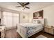 Inviting bedroom with dark wood floors and a ceiling fan for added comfort at 8544 E San Lorenzo Dr, Scottsdale, AZ 85258