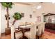 Elegant dining room featuring a chandelier, hardwood floors, and ample seating at 8544 E San Lorenzo Dr, Scottsdale, AZ 85258